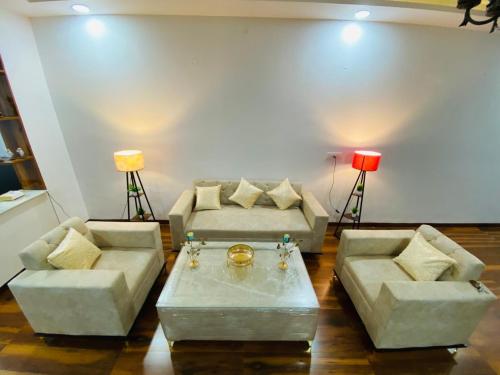a living room with two couches and a table at 3BHK Stay Royal Villa in Mohali in Zirakpur