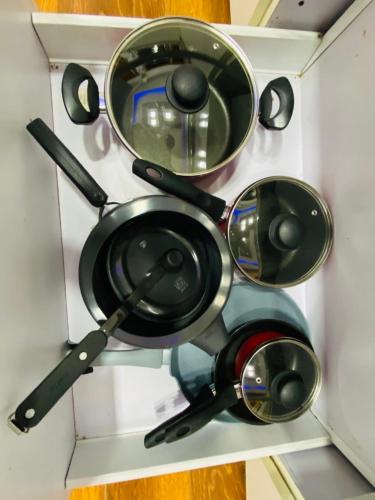 a bunch of pots and pans in a drawer at 3BHK Stay Royal Villa in Mohali in Zirakpur