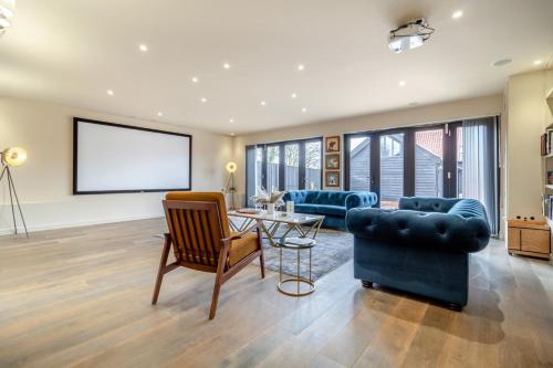 a living room with a couch and a table at White House Lodges - Napier in Heveningham