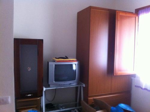 Telewizja i/lub zestaw kina domowego w obiekcie Appartamento Teulada
