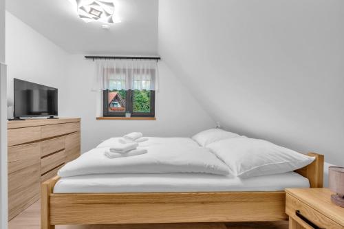 Postel nebo postele na pokoji v ubytování Relax chata Zvičina