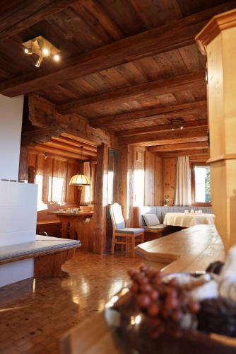a living room with a couch and a table at Landhaus Waldhof am Grossvolderberg in Volders