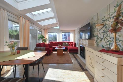 a living room with a couch and a table at Hotel San Marco in Füssen