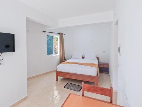 Residencial Mãe Nonaにあるベッド