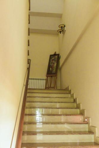 a staircase in a building with a painting at Hotel Zodiak in Radomsko