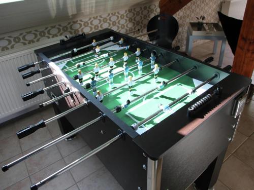 a foosball table with dolls on top of it at Theux Villa with Sauna in Theux