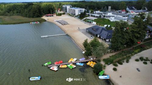 an aerial view of a group of boats in the water at Aquarius Holiday Boszkowo Apartamenty in Boszkowo