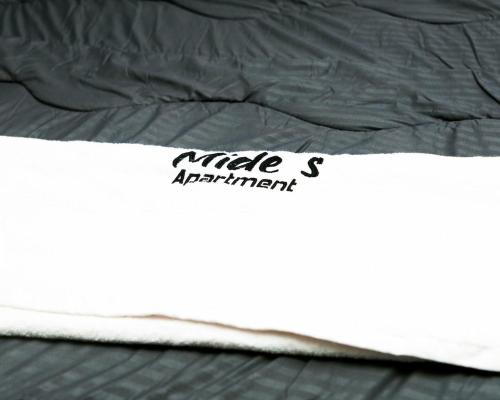 a close up of a bed with a mattressvisor at Oasis Beautiful 2 Bedroom Shortlet Apartment in Lekki