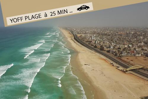 an aerial view of a beach and the ocean at La MAISON BLANCHE - Ch2A - CENTRAL - CALME - WIFI - White Butterfly Hotels in Dakar