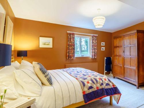 a bedroom with a large bed and a window at 2 Bed in Cockermouth 86528 in Arlecdon