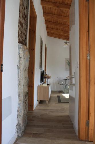a hallway in a house with a stone wall at VV Casa Bibiana "by henrypole home" in Hermigua