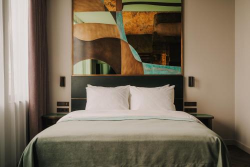 Postel nebo postele na pokoji v ubytování Cyrus Hotel