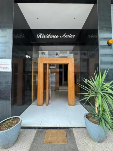 a wooden table in the front of a building at Comfortable 3 bedroom apartment ideally located in Fès