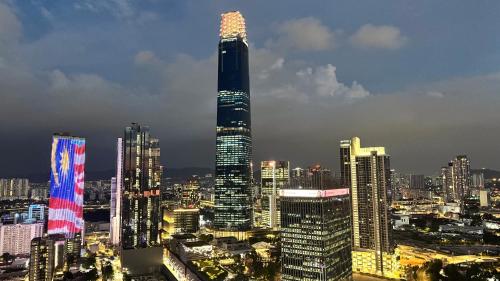 a view of a city skyline with a tall skyscraper at Axon Residence Pavilion Bukit Bintang SkyView in Kuala Lumpur