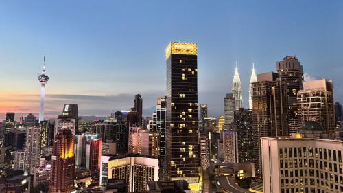 a view of a large city skyline with buildings at Axon Residence Pavilion Bukit Bintang SkyView in Kuala Lumpur