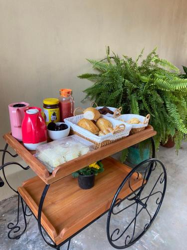 a tray of bread and other food on a table at casa de veraneio jalapão in São Félix do Tocantins