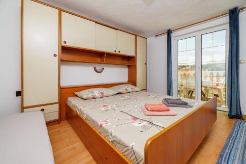 Ένα ή περισσότερα κρεβάτια σε δωμάτιο στο Apartments Ester