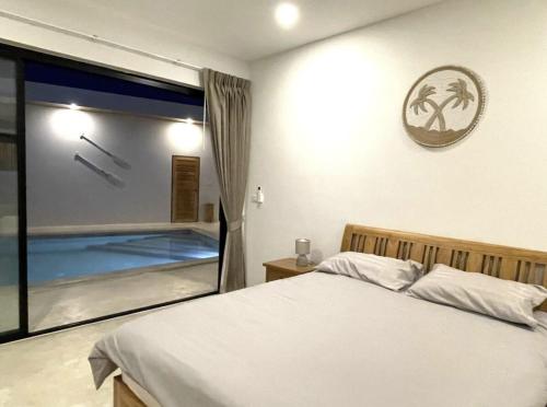 Postel nebo postele na pokoji v ubytování Villa YOLO 3 Chambres avec Piscine Privative