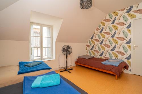 Llit o llits en una habitació de Gite Le Chêne