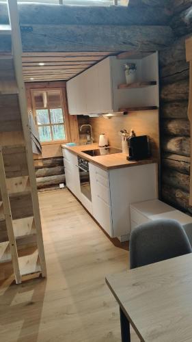 Kuchyň nebo kuchyňský kout v ubytování Luonto, das Blockhaus