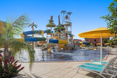 a pool with a water park with a water slide at Pickalbatros Aqua Fun Club All Inclusive in Marrakech