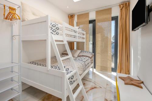 Ένα ή περισσότερα κρεβάτια σε δωμάτιο στο Palm Beach House