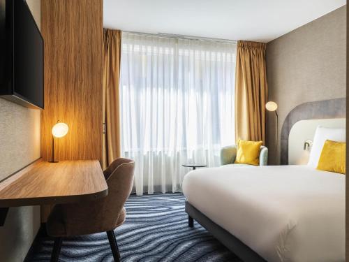 Un ou plusieurs lits dans un hébergement de l'établissement Mercure Amsterdam North Station