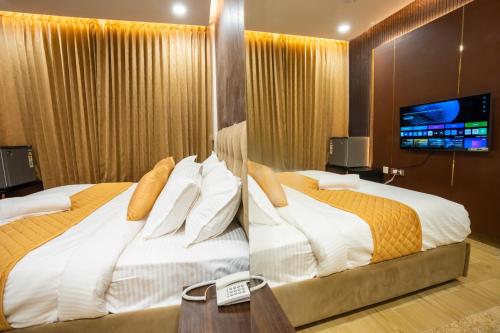Cama o camas de una habitación en Le Majestic Business Class Hotel