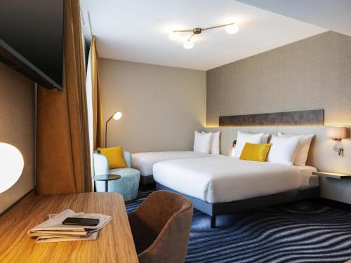 Télévision ou salle de divertissement dans l'établissement Mercure Amsterdam North Station