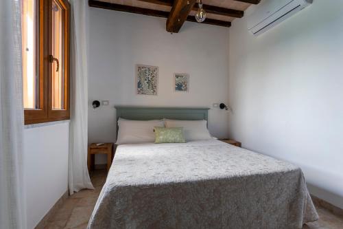Кровать или кровати в номере Relais e Spa l'Antica Fornace