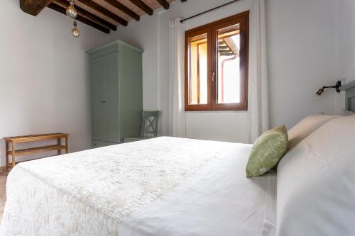Кровать или кровати в номере Relais e Spa l'Antica Fornace