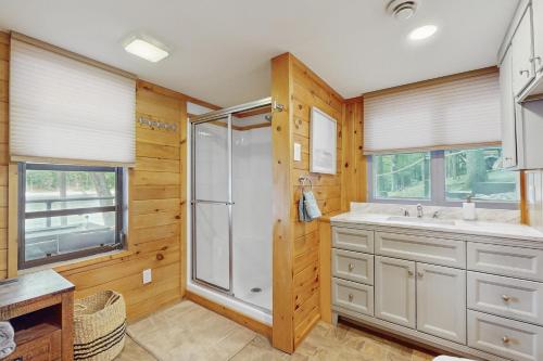 a bathroom with a shower and a sink at The Big Nest in Broadalbin