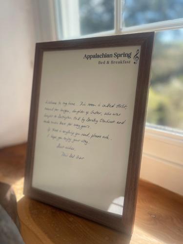 a picture of a frame with a document in front of a window at Appalachian Spring B&B in Dartington