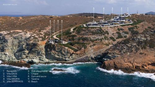 a road on a cliff next to the ocean at Rock Bay Villas - Luxury Villas in Crete in Agia Pelagia