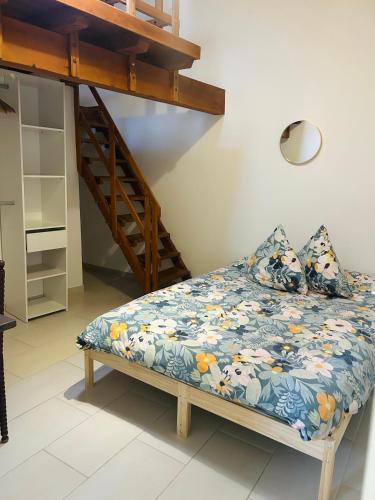 a bed in a room next to a bunk bed at Terracotta Nougat in Montélimar