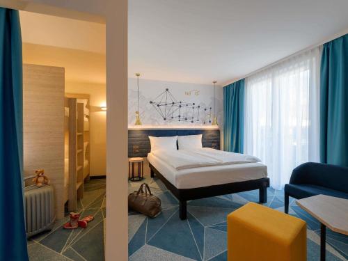 Cama o camas de una habitación en ibis Styles Bad Reichenhall