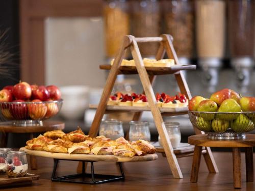 a table with three plates of food on display at Mercure Newcastle in Newcastle