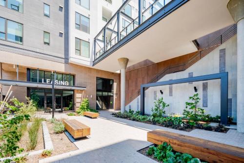 an exterior view of a building with a courtyard at Blueground Ingold - Milldale pool nr Park SFO-1969 in Millbrae