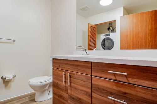 a bathroom with a toilet and a sink at Blueground Brighton fitness center nr Park SEA-876 in Seattle
