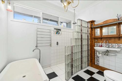 a bathroom with a toilet and a sink at Mini Beach Cottage - Seaspray Escape in Seaspray
