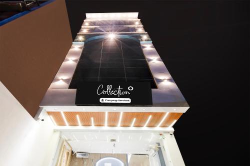 a sign for a store on the top of a building at Collection O Bairhana Road Prayagraj in Prayagraj