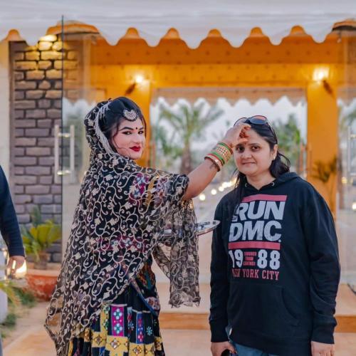 two women are standing next to each other at Welcome Jaisalmer Camp in Jaisalmer
