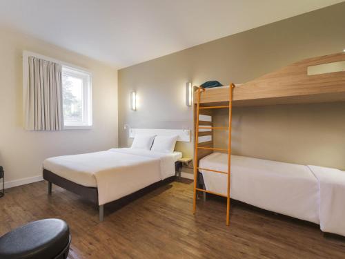 Postel nebo postele na pokoji v ubytování Ibis Budget Farroupilha