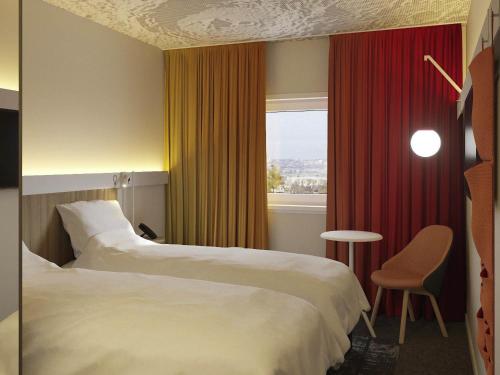 Cama o camas de una habitación en ibis Almaty Jetisu