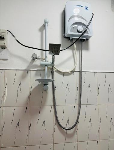 a wire hooked up to a wall in a room at Grand adamspeak hotel & restaurant in Adams Peak