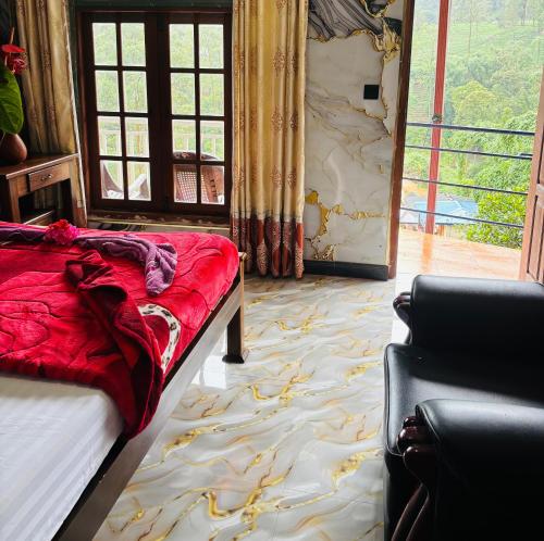 a bedroom with a bed and a large window at Grand adamspeak hotel & restaurant in Adams Peak