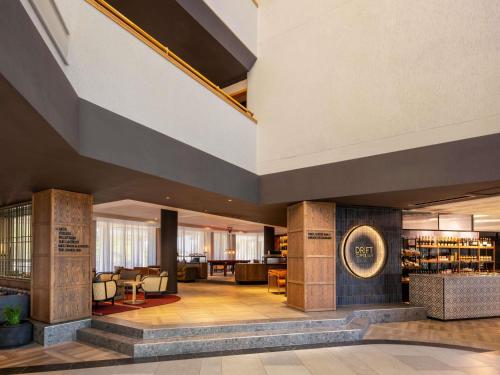 a lobby of a hotel with a large building at Mövenpick Hotel Windhoek in Windhoek