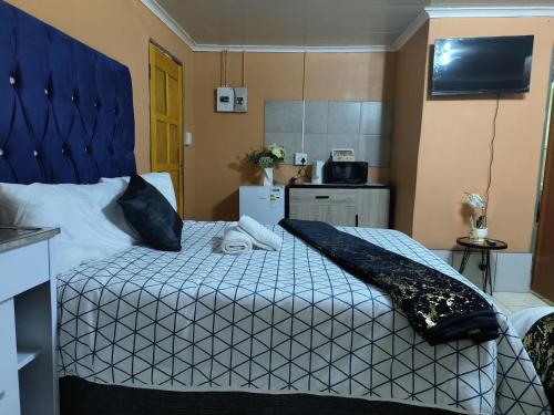 Postel nebo postele na pokoji v ubytování Acama Guest House