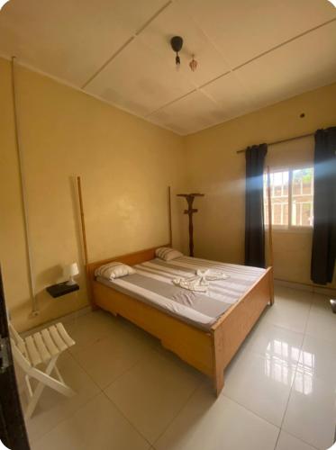 Una cama o camas en una habitación de Villa UCATEX proche des Nations Unis
