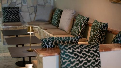 a living room with a couch and a table at Hotel Calanca in Marina di Camerota